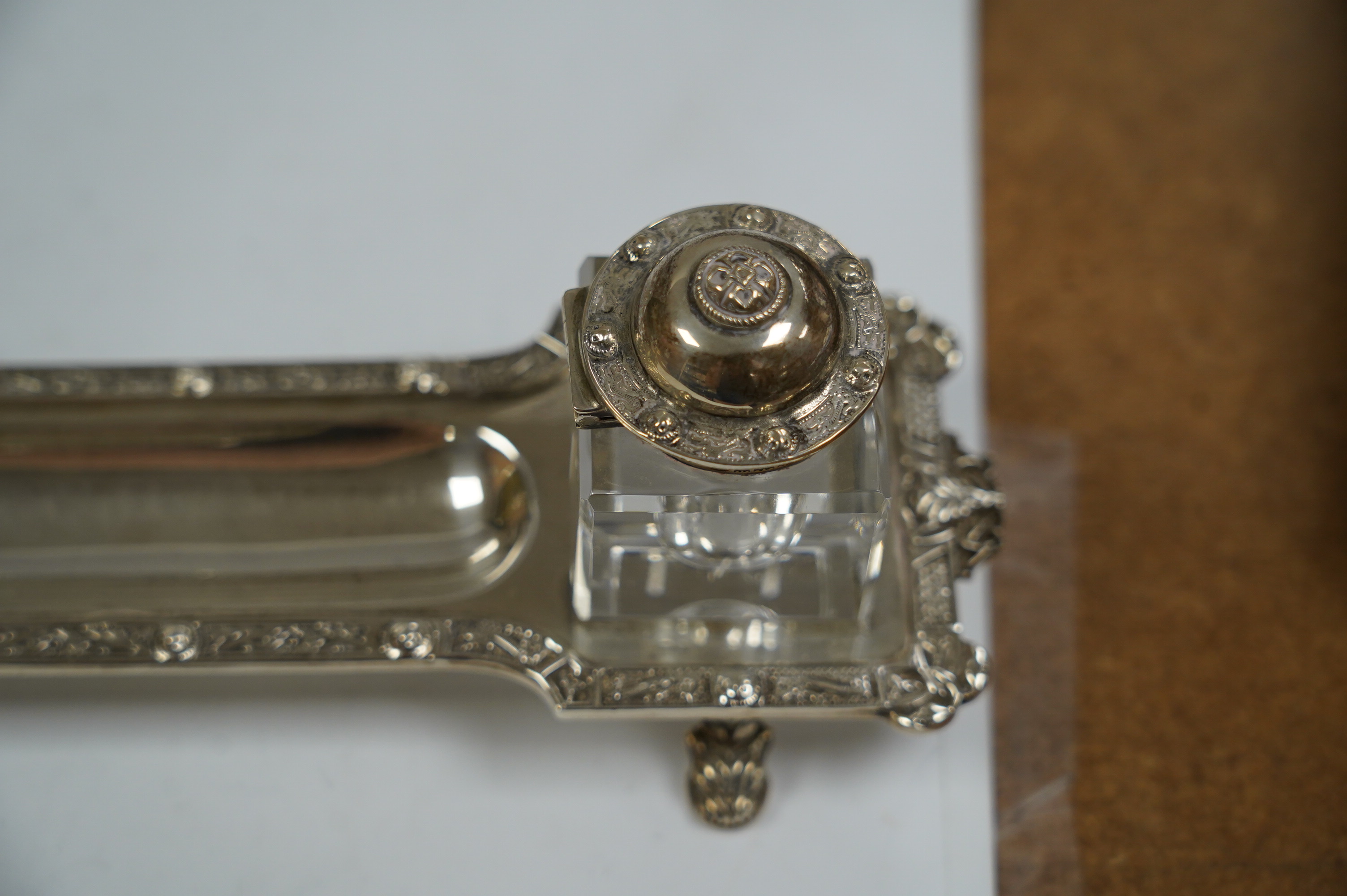 A modern silver inkstand with Celtic border and two mounted glass wells, Adie Bros. Birmingham, 1962, 26.3cm, 6.5oz. Condition - fair